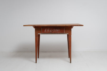 Country table in gustavian style from northern Sweden. The table is a rare example and has a large centered drawer and straight tapered legs