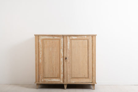 Neoclassic sideboard from northern Sweden. The sideboard has its original distressed paint. It is richly decorated with carved wooden decorations.