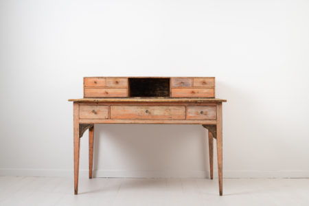 Unusual neoclassical writing table with a top gallery with drawers on each side. The table is made in northern Sweden around 1790 which is during the Swedish gustavian era.