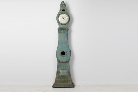 Antique long case clock from northern Sweden made during the late 1700s. The clock has the original blue-green paint with unusual decor