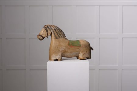 Antique wooden horse sculpture from northern Sweden. The horse is from around 1850 and has a body in pine with original paint