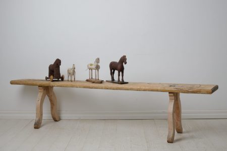 Antique folk art bench from Sweden made around 1820. The bench is made by hand in solid pine and has never been painted