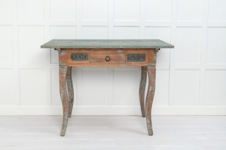  Antique Swedish handmade table in rococo style. The table is a country furniture with neat proportions and gently curved legs.