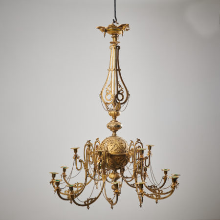 Antique Swedish bronzed chandelier made during the mid 1800s, around 1850 to 1860. The chandelier is made in bronzed metal with a richly decorated round frame