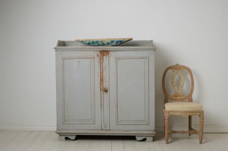 Antique Swedish rustic sideboard from northern Sweden. The sideboard is an authentic country house furniture from around 1840.