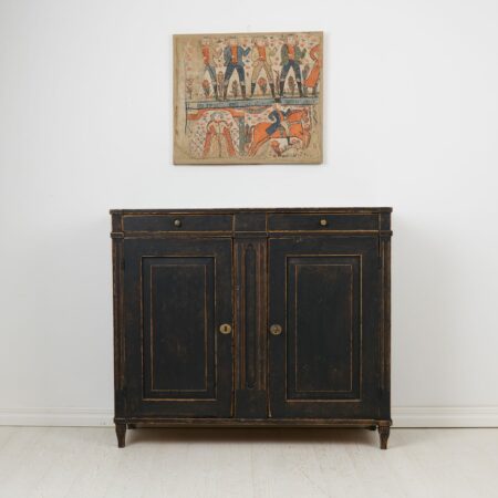 Swedish country antique sideboard from the gustavian period during the late 1700s. The sideboard has a classic straight shape with two doors