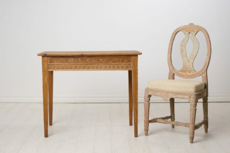 Antique console table in gustavian style dated September 24th 1852. Straight tapered legs, apron with period-typical gustavian carved leaves.