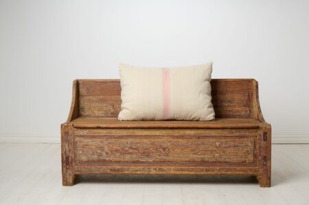 Primitive antique rustic bench in folk art from northern Sweden. Made by hand with a frame in solid pine around 1820 to 1840.