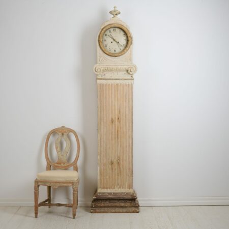 Gustavian long case clock from Sweden made during the late 1700s. Unusual straight column-shaped case with the classic gustavian ribbed decor.