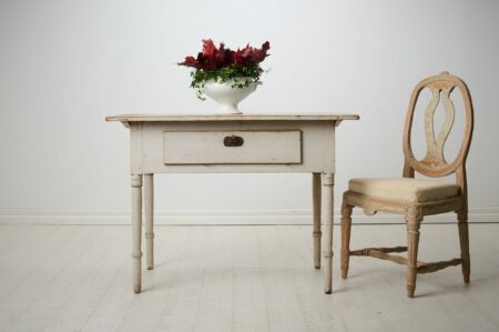 Antique folk art table in empire style from northern Sweden. This country house furniture is made around 1840 to 1850 with a frame in solid pine. Antique folk art table in empire style from northern Sweden. This country house furniture is made around 1840 to 1850 with a frame in solid pine.