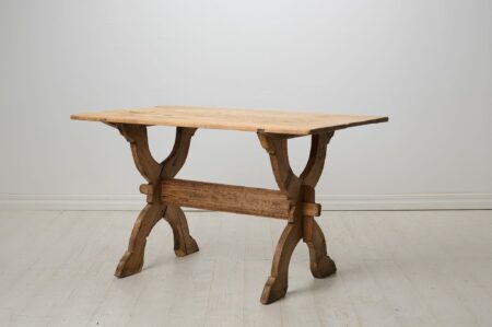 Primitive antique trestle table from northern Sweden made by hand around 1820 in solid pine. The pine has never been painted