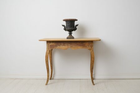 Genuine antique rococo table from northern Sweden. The table rectangular and the same from both sides. From the rococo period around 1770.