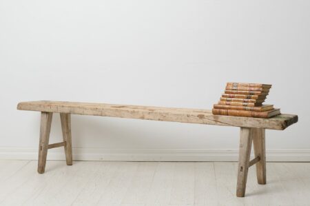 Rustic primitive bench from the early 1800s. Made by hand in solid pine in northern Sweden around 1830. The seat is made from just one board