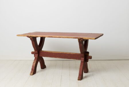 Early 19th century dining table or work table from Sweden. This antique table is a genuine trestle table from northern Sweden made around 1820.
