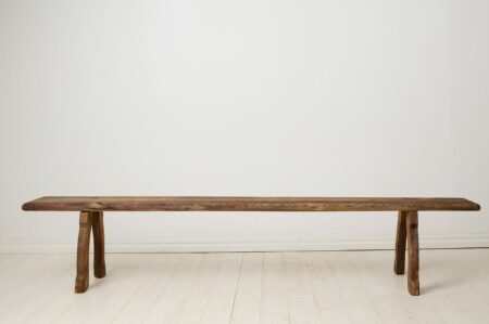 Primitive rustic Swedish bench from the early 1800s. Made in northern Sweden from pine, the bench has never been painted