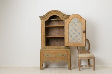 Rare antique rococo cabinet from the late 1700s. The cabinet is an authentic country house furniture from Northern Sweden.