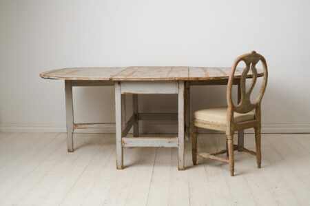 Large drop leaf table made by hand in solid pine during the mid 1800s in northern Sweden, circa 1850 to 1860.