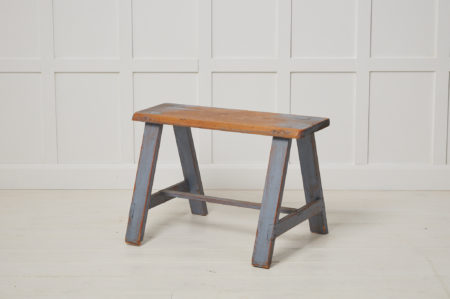 Small antique Swedish bench in folk art. The frame is made by hand in solid Swedish pine. The original light blue paint has genuine distress and patina after use