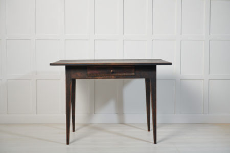 Genuine Swedish antique table with a drawer in gustavian style. The table is made by hand from solid Swedish pine around 1820 to 1830
