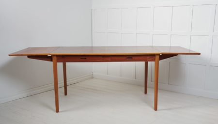 Scandinavian modern desk or dining table by Nils Jonsson for Troeds. Made in Sweden around 1960 with a table top in teak and beech leg frame