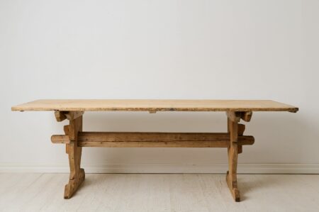 Antique country dining table made in northern Sweden. An early 19th century antique made by hand in pine around 1820 in solid pine.