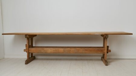 Large trestle dining table from northern Sweden. Made by hand in solid pine around 1860. The table top and the leg frame are an original pair