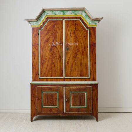 Swedish folk art cabinet from 1857. The cabinet has its origin on a farm estate in Northern Sweden, in the province Jämtland.