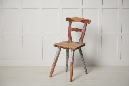 Unusual primitive country chair in folk art from Northern Sweden. The chair is a one of a kind piece made by hand in solid pine around 1820 to 1840