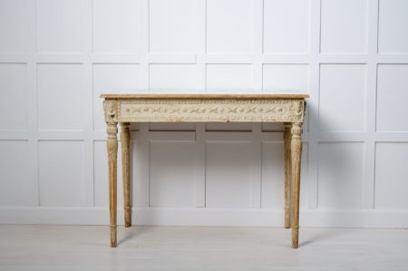 Swedish gustavian console table in painted pine. The table is made around 1790 to 1800 and has detailed carved wooden decor