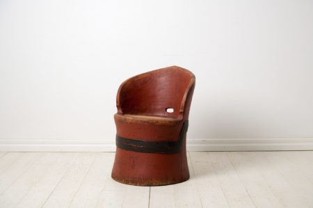Antique Swedish stump chair with original red paint. The chair is a primitive furniture made by hand from one large, solid log of wood