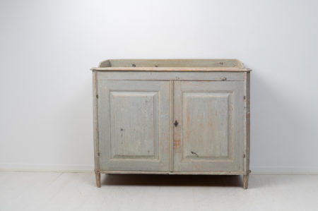 Rare antique gustavian sideboard from Northern Sweden made around 1780. The sideboard is made in painted pine and dry scraped by hand down to the original paint